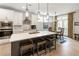 Stylish kitchen with a large island, white cabinets, stainless steel appliances, and pendant lights at 15 Lakeside Way, Cartersville, GA 30121
