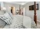 Well-lit main bedroom featuring a four-poster bed, flat screen television, and stylish decor at 15 Lakeside Way, Cartersville, GA 30121