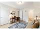 Comfortable office space featuring a wooden desk and a view into the bathroom at 15 Lakeside Way, Cartersville, GA 30121