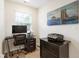 Modern home office with window, desk, chair, artwork, and ample lighting at 15 Lakeside Way, Cartersville, GA 30121