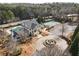 Aerial shot of a community pool, tennis courts, and clubhouse surrounded by trees and fountain at 15 Lakeside Way, Cartersville, GA 30121