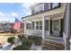 Inviting front porch with stone steps, white railings, and a charming gray bench at 15 Lakeside Way, Cartersville, GA 30121