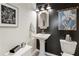 Stylish powder room featuring modern fixtures, elegant black and white walls, and chic decor at 15 Lakeside Way, Cartersville, GA 30121