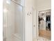 Modern bathroom with glass shower, tiled floors, and access to walk-in closet at 15 Lakeside Way, Cartersville, GA 30121