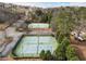Aerial view showcasing multiple tennis courts within a well-maintained community setting, surrounded by lush greenery at 15 Lakeside Way, Cartersville, GA 30121