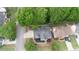 Aerial view of the property showcasing the home's layout and manicured landscaping at 200 Ridge Bluff Ln, Suwanee, GA 30024