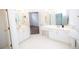 Bathroom featuring tile floors, vanity with double sinks, and a large mirror at 200 Ridge Bluff Ln, Suwanee, GA 30024