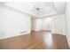 Bright bedroom with hardwood floors, white trim and ceiling fan at 200 Ridge Bluff Ln, Suwanee, GA 30024