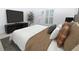 Bedroom features a TV, large bed, and shutters at 200 Ridge Bluff Ln, Suwanee, GA 30024