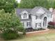 Charming two-story home with manicured lawn and mature landscaping at 200 Ridge Bluff Ln, Suwanee, GA 30024