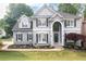 Charming two-story home with a manicured lawn and inviting front entrance at 200 Ridge Bluff Ln, Suwanee, GA 30024