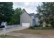 Charming home with long driveway, garage, and lush landscaping at 200 Ridge Bluff Ln, Suwanee, GA 30024