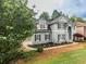 Attractive two-story home with well-maintained landscaping and architectural details at 200 Ridge Bluff Ln, Suwanee, GA 30024