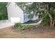 A charming home with a well-manicured lawn and a side-entry garage at 200 Ridge Bluff Ln, Suwanee, GA 30024