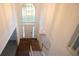 View of the foyer from the staircase highlighting the hardwood floors and grand entryway at 200 Ridge Bluff Ln, Suwanee, GA 30024