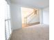 View of entry foyer with staircase, hardwood flooring visible beyond entrance at 200 Ridge Bluff Ln, Suwanee, GA 30024