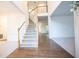 Bright foyer with hardwood flooring and staircase leading to the upper level at 200 Ridge Bluff Ln, Suwanee, GA 30024