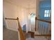 View of the foyer from the staircase highlighting the hardwood floors and grand entryway at 200 Ridge Bluff Ln, Suwanee, GA 30024