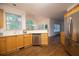 Bright kitchen featuring wood cabinets, stainless steel appliances, and wood flooring at 200 Ridge Bluff Ln, Suwanee, GA 30024
