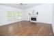 Bright living room with a fireplace, hardwood floors, and natural light at 200 Ridge Bluff Ln, Suwanee, GA 30024