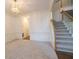 Inviting living room with a staircase and wall paneling at 200 Ridge Bluff Ln, Suwanee, GA 30024
