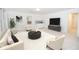 Cozy living room with comfortable seating and a tv set, perfect for relaxation at 200 Ridge Bluff Ln, Suwanee, GA 30024