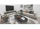 Cozy living room with sleek furniture, modern decor, and stylish rug at 200 Ridge Bluff Ln, Suwanee, GA 30024