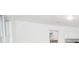 The living room features bright white walls, natural light and an attached kitchen area at 200 Ridge Bluff Ln, Suwanee, GA 30024