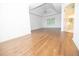 Spacious main bedroom with hardwood floors and an en-suite bath at 200 Ridge Bluff Ln, Suwanee, GA 30024