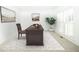 Bright office space featuring a wooden desk, chair, and a modern geometric rug at 200 Ridge Bluff Ln, Suwanee, GA 30024