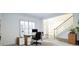 Dedicated office space with ample natural light, desk, and view of the foyer at 200 Ridge Bluff Ln, Suwanee, GA 30024