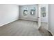 Light and airy bedroom with two windows and neutral carpeting at 453 Inkberry Dr, Atlanta, GA 30349
