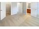 Bedroom featuring neutral carpet, light gray walls, and doorways to the closet and bathroom at 453 Inkberry Dr, Atlanta, GA 30349