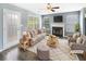 Inviting living room with a cozy fireplace, ample seating, and plenty of natural light at 453 Inkberry Dr, Atlanta, GA 30349