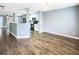 Open-concept living area with wood floors and view into the kitchen at 453 Inkberry Dr, Atlanta, GA 30349