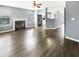 Open-concept floor plan with a fireplace and view of the kitchen at 453 Inkberry Dr, Atlanta, GA 30349