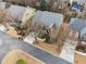 Aerial view of a two-story home in a residential neighborhood shows the well-manicured lawn and surrounding landscape at 822 Pistace Ct, Alpharetta, GA 30022