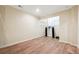 Basement area with hardwood floors, shelves, neutral walls, and built-in equipment at 822 Pistace Ct, Alpharetta, GA 30022