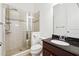 Bathroom featuring a glass-enclosed shower and dark-toned vanity, offering a functional space at 822 Pistace Ct, Alpharetta, GA 30022