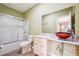 Bathroom features an undermount vanity, glass bowl sink, tile floors, and a shower/tub with sliding glass doors at 822 Pistace Ct, Alpharetta, GA 30022