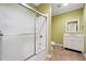 Bathroom with tile floors, a shower and tub with sliding glass doors, vanity, and a framed mirror at 822 Pistace Ct, Alpharetta, GA 30022