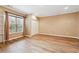 Bedroom features hardwood floors, natural light, a closet, base molding, and neutral walls at 822 Pistace Ct, Alpharetta, GA 30022