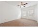 Spacious bedroom features a ceiling fan and large windows at 822 Pistace Ct, Alpharetta, GA 30022