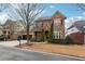 Attractive two-story brick home with a neatly landscaped front yard and a two-car garage at 822 Pistace Ct, Alpharetta, GA 30022