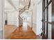 Bright foyer with hardwood floors and a curved staircase leading to the second floor at 822 Pistace Ct, Alpharetta, GA 30022