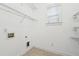 Laundry room with wire shelving, tile floors, and neutral paint at 822 Pistace Ct, Alpharetta, GA 30022