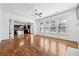 Living room boasts hardwood floors, a fireplace, and a view of the kitchen at 822 Pistace Ct, Alpharetta, GA 30022