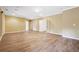Spacious living room featuring hardwood floors, neutral walls, recessed lighting, and ample natural light at 822 Pistace Ct, Alpharetta, GA 30022