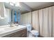 Bright bathroom with a neutral vanity, modern fixtures, and a light shower curtain at 101 Fair Haven Se Way, Smyrna, GA 30080