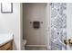 Bright bathroom showcasing a neutral color palette, towel rack, and patterned shower curtain at 101 Fair Haven Se Way, Smyrna, GA 30080